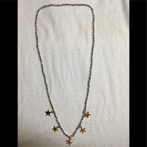 Necklace -silver beads with gold stars.